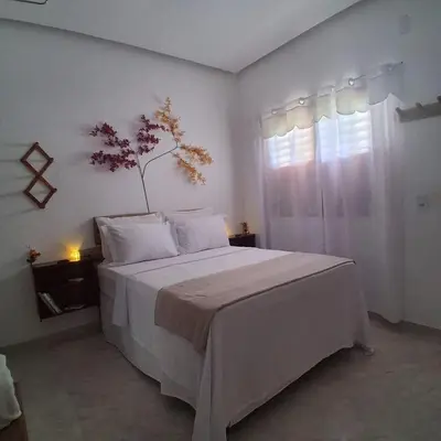 Uma cama ou camas num quarto em Preá, Suíte Privativa próximo ao Parque Nacional de Jeri
