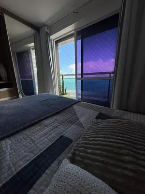 Uma cama ou camas num quarto em Ap maravilhoso vista mar na melhor região de Fortaleza