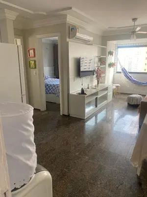 Uma televisão e/ou sistema de entretenimento em Apartment with sea view on Iracema Beach