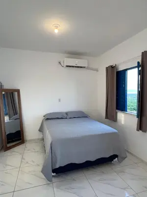 Uma cama ou camas num quarto em Apartamento da Kenia