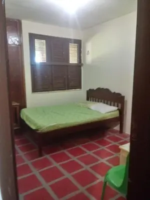 Uma cama ou camas num quarto em Maravilhosa Casa de Praia em Morro Branco