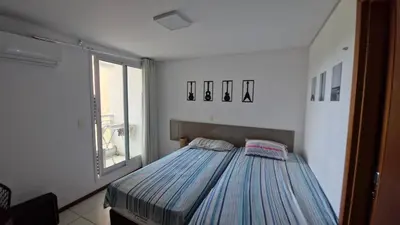 Uma cama ou camas num quarto em Catu Lake Residence