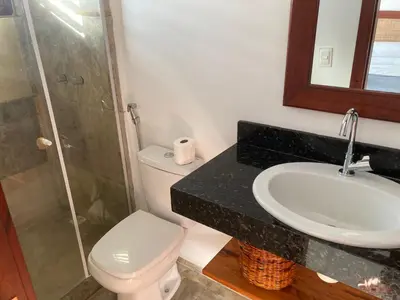 Uma casa de banho em Casa Encanto dos Corais