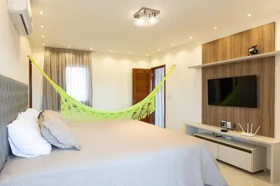 Uma cama ou camas num quarto em Casa Porpora Cumbuco