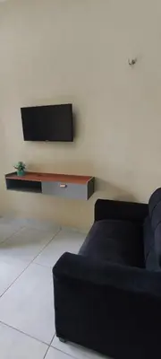 Uma televisão e/ou sistema de entretenimento em Casa do paraíso