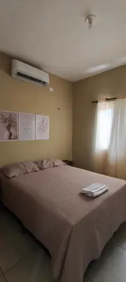 Uma cama ou camas num quarto em Casa do paraíso