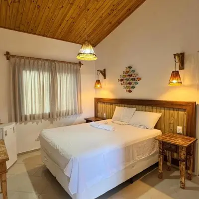 Uma cama ou camas num quarto em Pousada Caponga Praia Mar