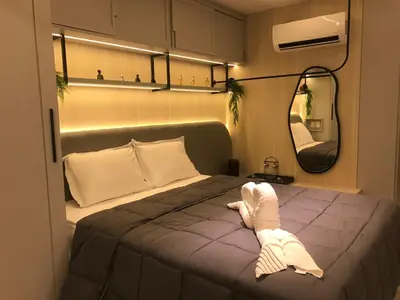 Uma cama ou camas num quarto em Studio Safira no Meireles próximo à Praia de Iracema