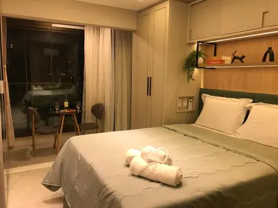 Uma cama ou camas num quarto em Studio Rubi no Meireles próximo à Beira-Mar