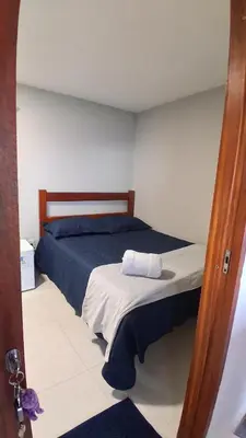 Uma cama ou camas num quarto em Chalé Lá Aurora