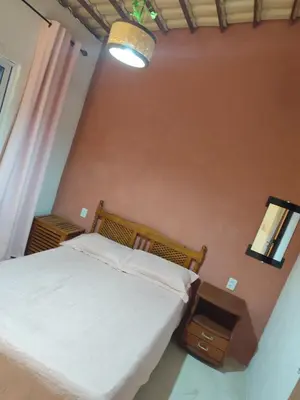 Uma cama ou camas num quarto em Recanto dos sonhos