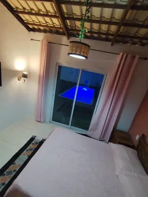 Uma cama ou camas num quarto em Recanto dos sonhos