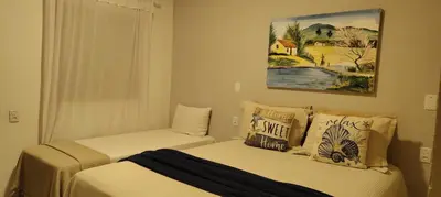 Uma cama ou camas num quarto em Vila Pescador Fortim