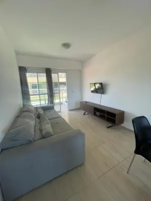 Uma área de estar em Apartamento no Beach Place Cumbuco