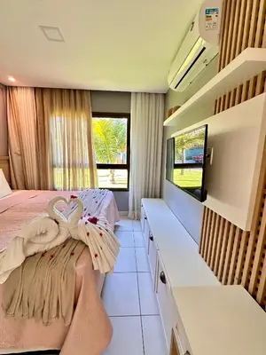 Uma cama ou camas num quarto em Térreo Completo Varanda VG SUN CUMBUCO