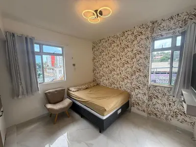 Uma cama ou camas num quarto em Apartamento temporada