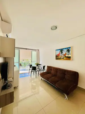 Uma televisão e/ou sistema de entretenimento em Super Apartamento Palm Beach