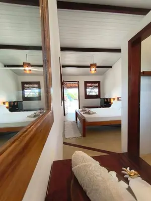 Uma cama ou camas num quarto em Villa Tarifa Icaraizinho Suítes