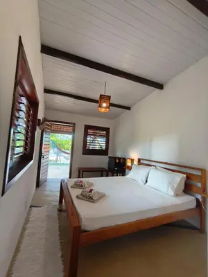 Uma cama ou camas num quarto em Villa Tarifa Icaraizinho Suítes