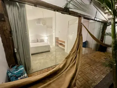 Uma cama ou camas num quarto em Casa Emboá Kite house in Praia da Emboaca!