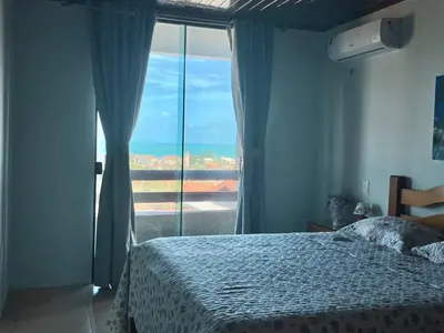 Uma cama ou camas num quarto em Casa de praia Porto das dunas