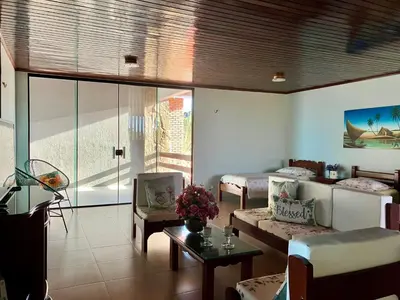 Uma área de estar em Casa de praia Porto das dunas