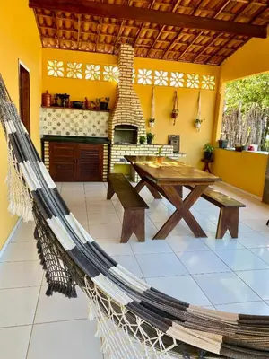 Uma área de estar em Casa da Helô