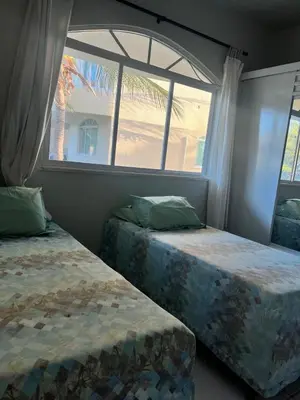 Uma cama ou camas num quarto em Green Paradise Residence Praia de Canoa Quebrada