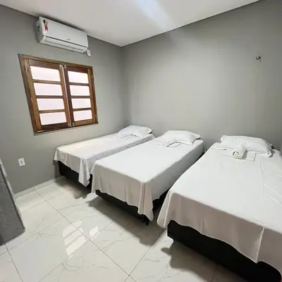 Uma cama ou camas num quarto em Casa com 3 dormitórios na Praia do Preá com Piscina