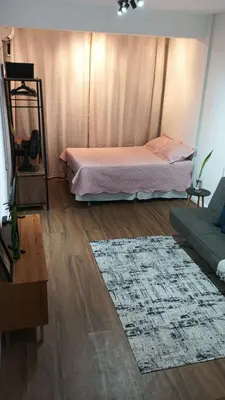 Uma cama ou camas num quarto em Flat Aconchego Beira Mar
