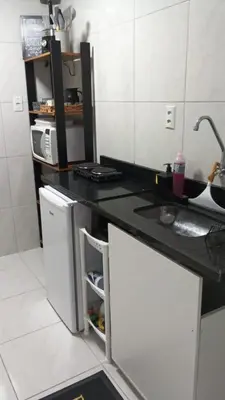 A cozinha ou kitchenette de Flat Aconchego Beira Mar