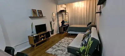Uma televisão e/ou sistema de entretenimento em Flat Aconchego Beira Mar