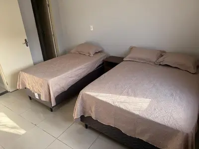 Uma cama ou camas num quarto em Casa Loft Mob 2 suítes próx Arena Castelão