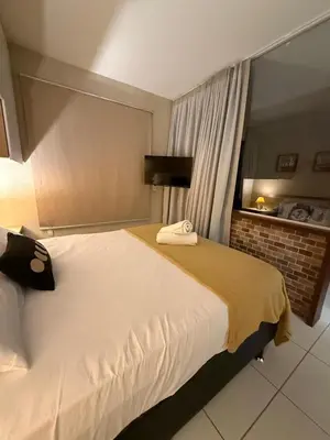 Uma cama ou camas num quarto em RESORT VG SUN CUMBUCO Vista Mar Kite