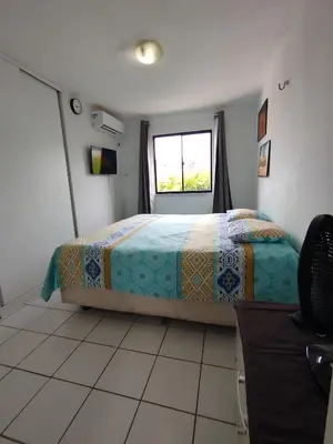 Uma cama ou camas num quarto em Cumbuco Geek House