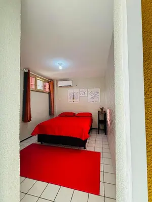 Uma cama ou camas num quarto em Casa da mãe Joana