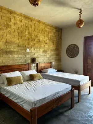 Uma cama ou camas num quarto em Chalé Brisa do Pontal