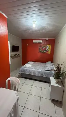 Uma cama ou camas num quarto em Pousada Novo Amanhecer