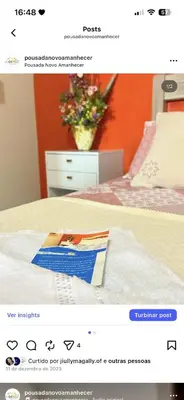 Uma cama ou camas num quarto em Pousada Novo Amanhecer