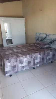 Uma cama ou camas num quarto em Casa de praia de frente para o mar