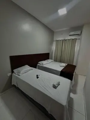 Uma cama ou camas num quarto em Hotel complexo paris