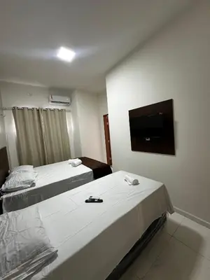 Uma cama ou camas num quarto em Hotel complexo paris