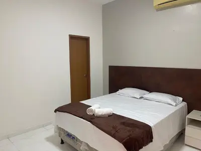 Uma cama ou camas num quarto em Hotel complexo paris