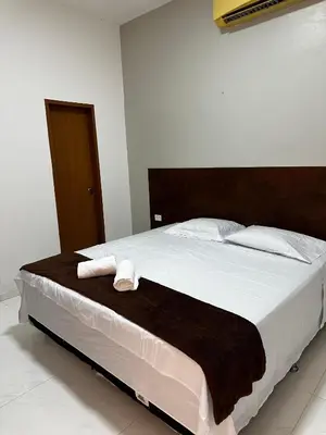 Uma cama ou camas num quarto em Hotel complexo paris