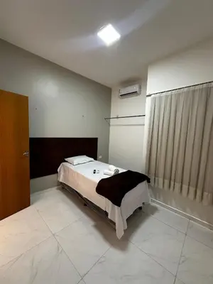 Uma cama ou camas num quarto em Hotel complexo paris