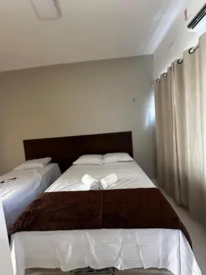 Uma cama ou camas num quarto em Hotel complexo paris