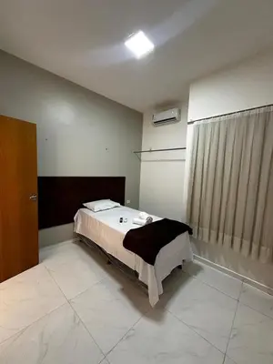 Uma cama ou camas num quarto em Hotel complexo paris