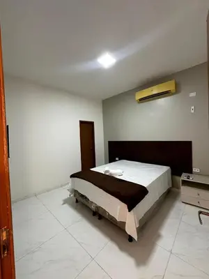 Uma cama ou camas num quarto em Hotel complexo paris