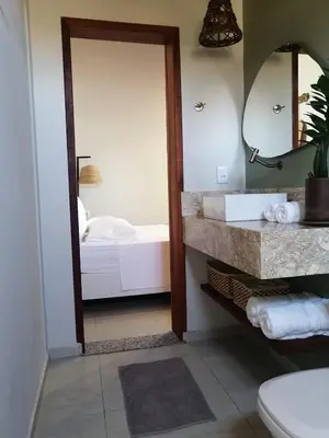 Uma cama ou camas num quarto em Vila Refúgio