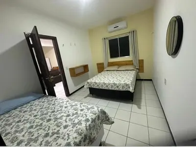 Uma cama ou camas num quarto em Apartamento Amarelinho - Canoa Quebrada
